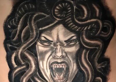 Black and grey realism Medusa tattoo by Clockwork Tattoo Shop in Centereach, Long Island, New York.